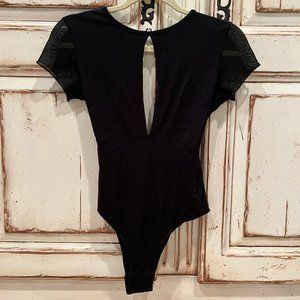 Joah Brown black short sleeve, open back bodysuit with front slit size M/L